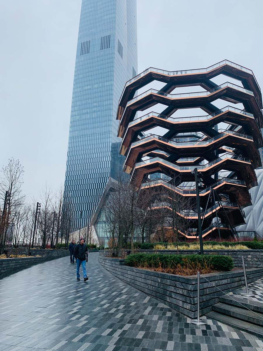 office building people walking on pathway near building during daytime city